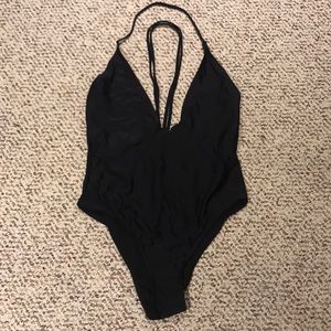 Deep plunge black one piece
